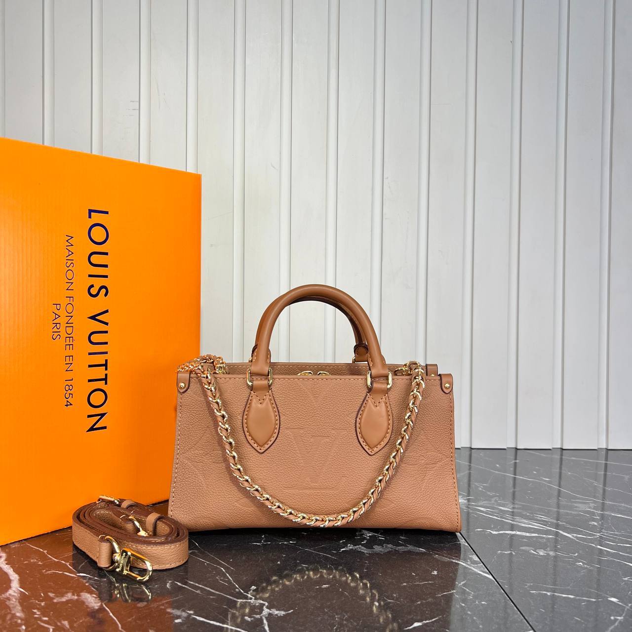 Louis V OnTheGo East West Genuine Leather